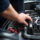 Certified technician inspecting Japanese car engine